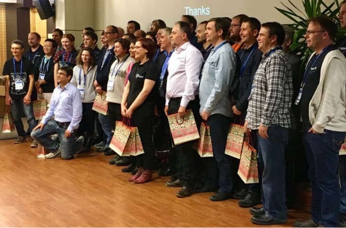 Speakers photo from Tallinn, 2016. I am in the middle holding two gift bags.